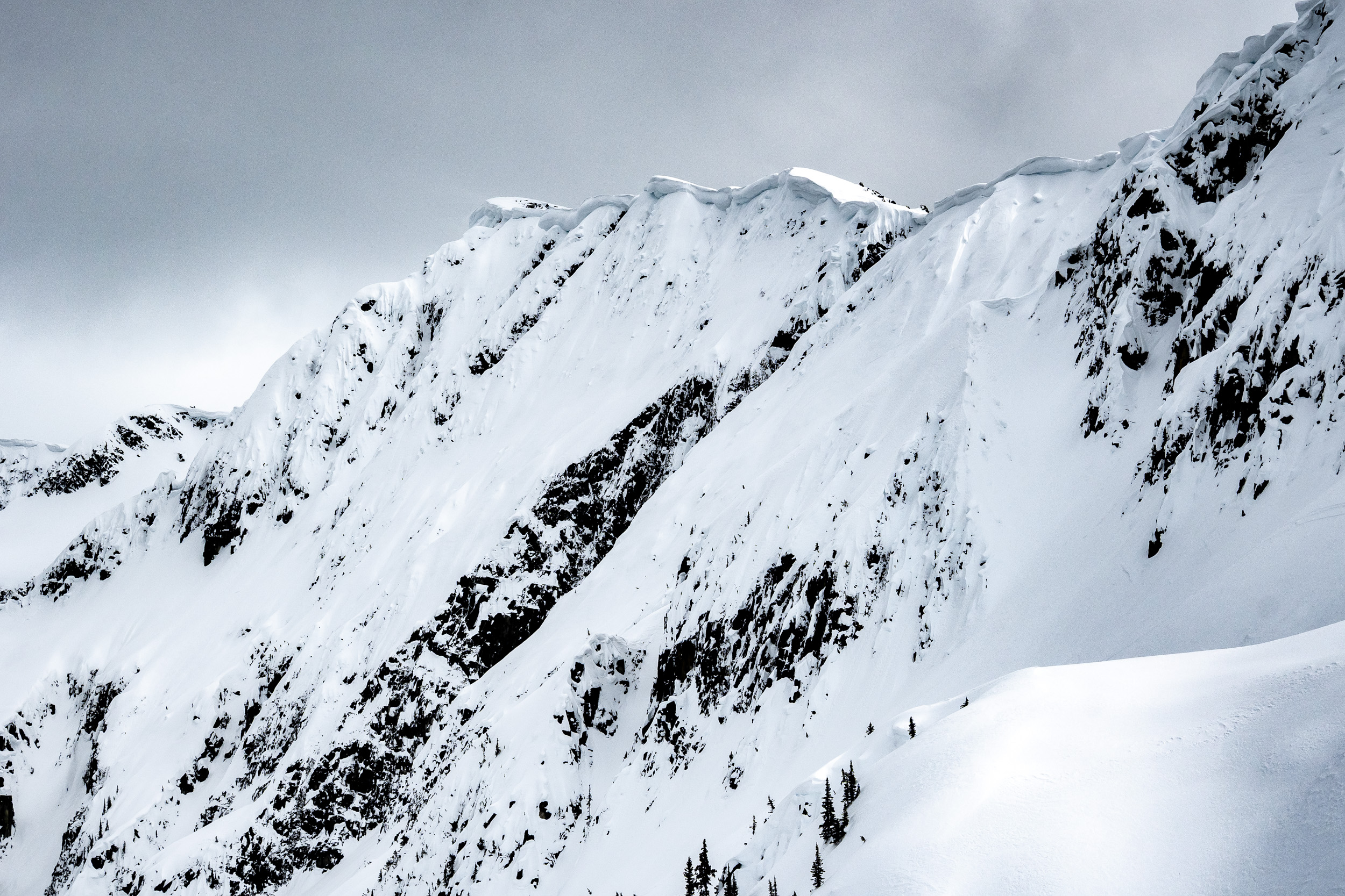 Heavily corniced ridge and steep alpine slopes on Steep Peak